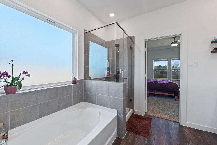 Enjoy the primary bathroom where you can relax in the large tub or use the separate walk in shower