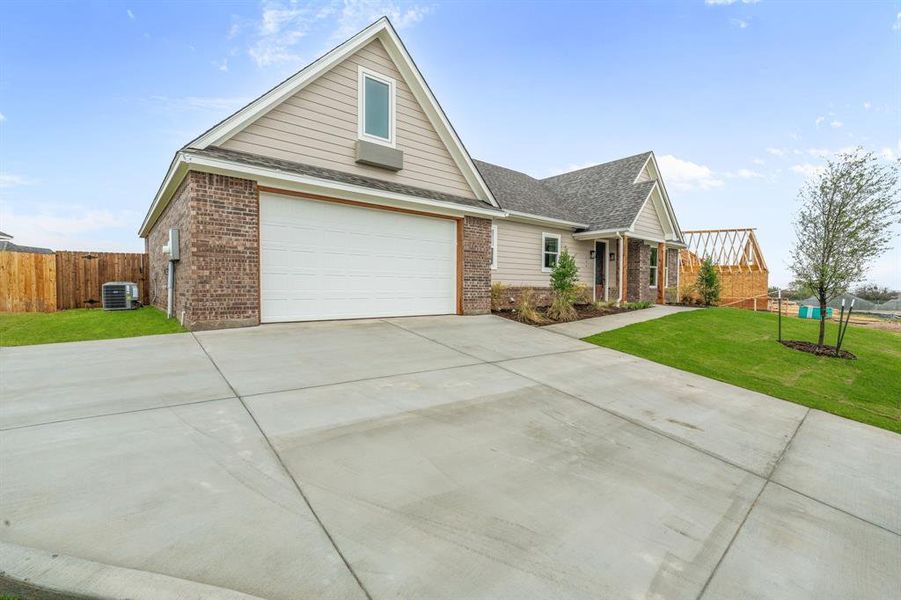 Front exterior of a new home in , Glen Rose, TX, highlighting curb appeal (Image 19). Front exterior of a new home in , Glen Rose, TX, highlighting curb appeal (Image 19).