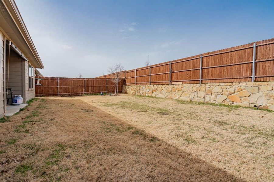 View of yard featuring a fenced backyard