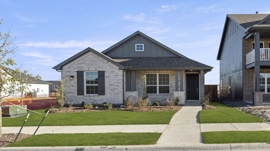 Front exterior of a new home in Waterscape, Royse City, TX, highlighting curb appeal (Image 1). Front exterior of a new home in Waterscape, Royse City, TX, highlighting curb appeal (Image 1).
