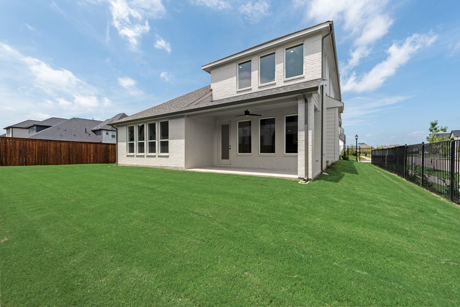 Exterior details and patio area of a home in Estates at Rockhill, Oak Point (Image 4).