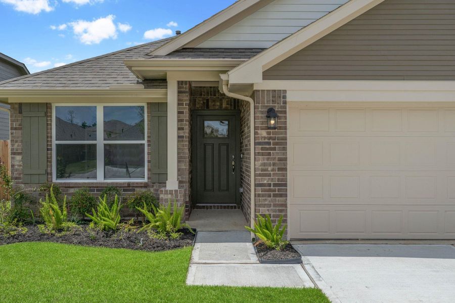 Front exterior of a new home in Grand Oaks Reserve, Cleveland, TX, highlighting curb appeal (Image 17). Front exterior of a new home in Grand Oaks Reserve, Cleveland, TX, highlighting curb appeal (Image 17).