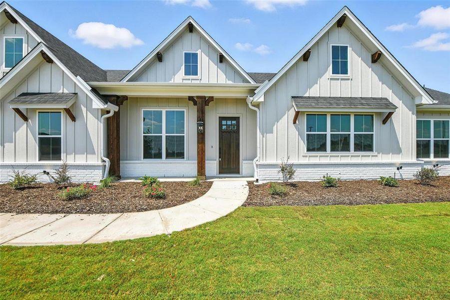 Front exterior of a new home in Rocky Top Ranch, Reno, TX, highlighting curb appeal (Image 22). Front exterior of a new home in Rocky Top Ranch, Reno, TX, highlighting curb appeal (Image 22).
