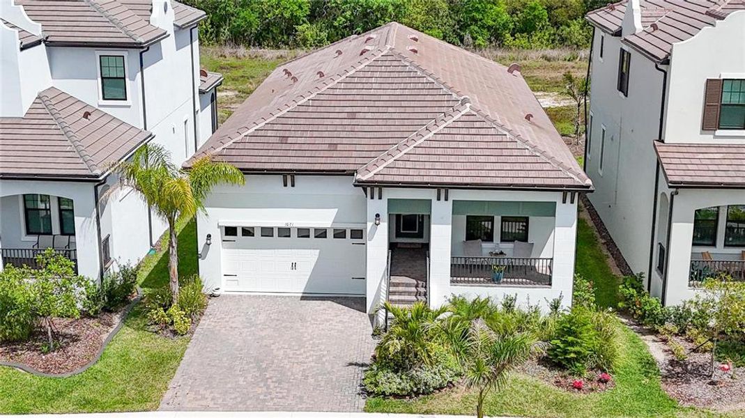 Front exterior of a new home in SouthShore Yacht Club, Ruskin, FL, highlighting curb appeal (Image 31). Front exterior of a new home in SouthShore Yacht Club, Ruskin, FL, highlighting curb appeal (Image 31).