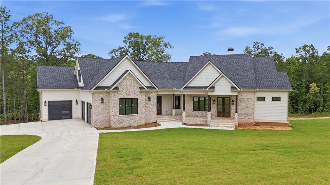 Front exterior of a new home in , Newnan, GA, highlighting curb appeal (Image 2). Front exterior of a new home in , Newnan, GA, highlighting curb appeal (Image 2).