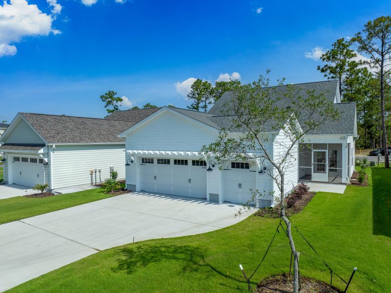 Front exterior of a new home in Osprey Landing, Southport, NC, highlighting curb appeal (Image 30).