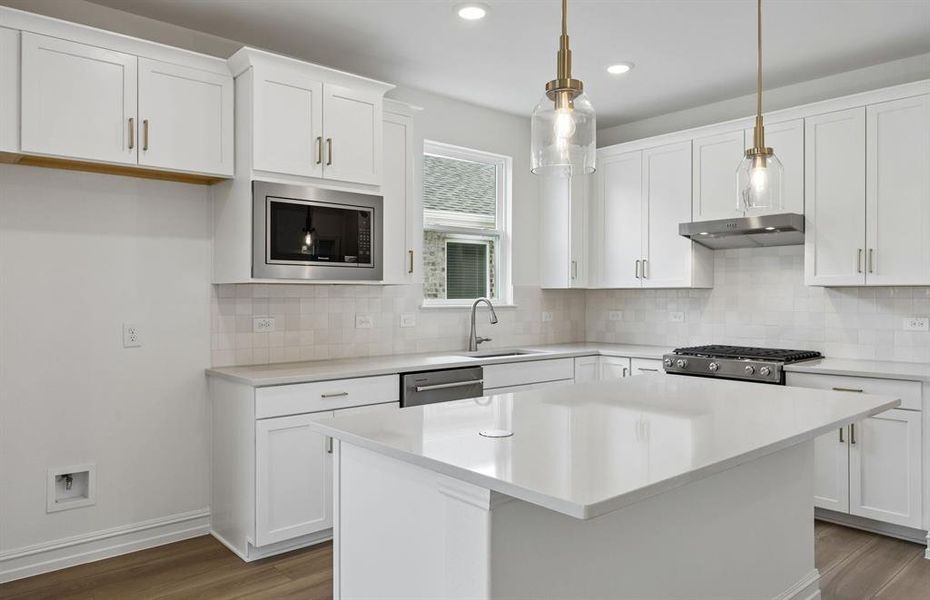 Kitchen with beautiful pendent lighting