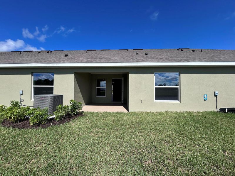 Front exterior of a new home in Waterstone Villas, Fort Pierce, FL, highlighting curb appeal (Image 20). Front exterior of a new home in Waterstone Villas, Fort Pierce, FL, highlighting curb appeal (Image 20).