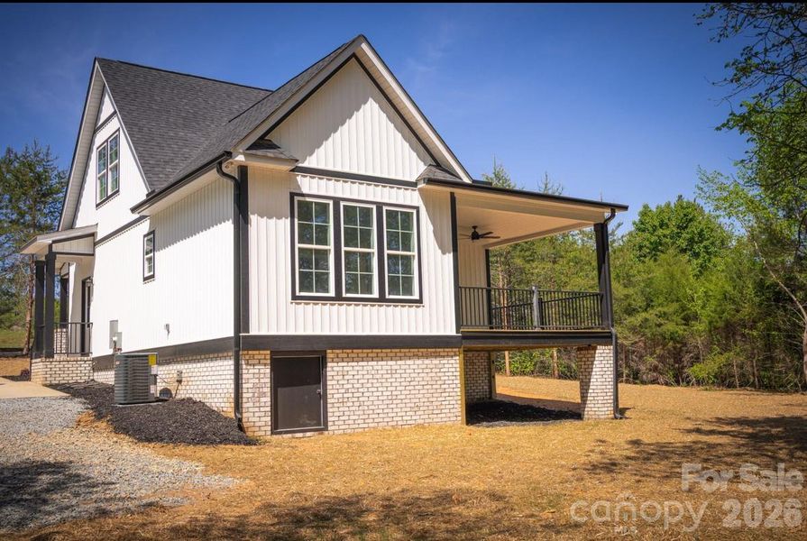 Exterior details and patio area of a home in , Oakboro (Image 29).