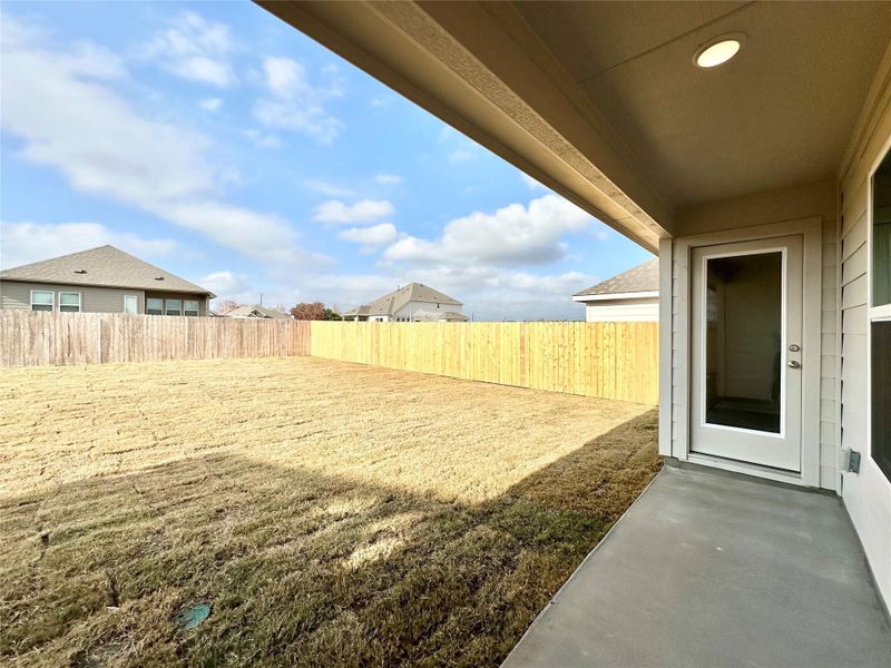 Fenced backyard with a patio Fenced backyard with a patio