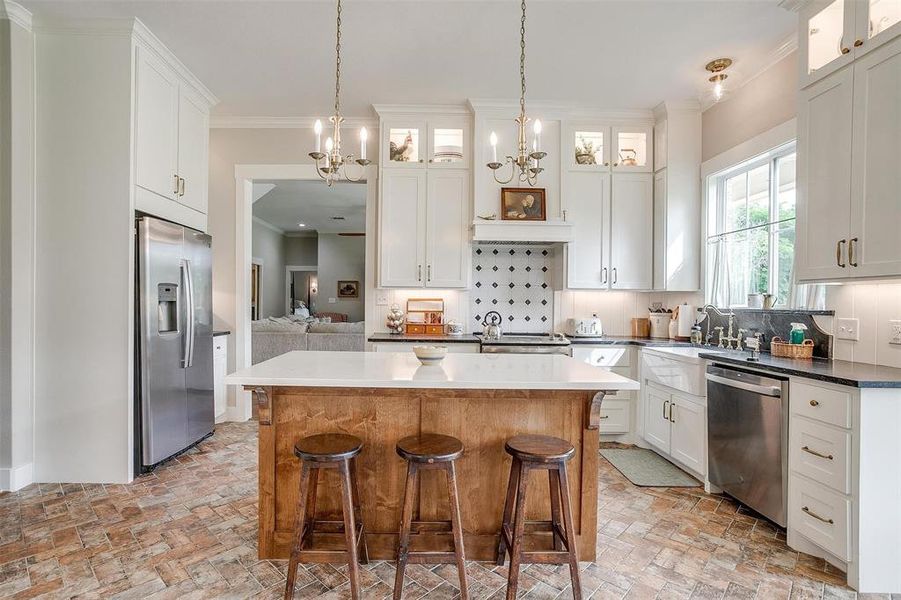 Large kitchen with pendant lighting & white cabinets. Large kitchen with pendant lighting & white cabinets.