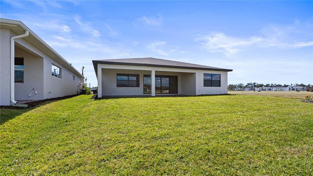 Exterior details and patio area of a home in Woodland Preserve, Parrish (Image 20).