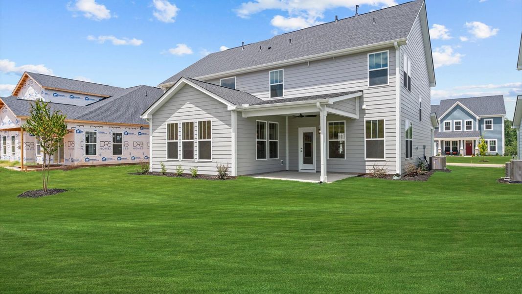 Front exterior of a new home in Wells Crossing, Seneca, SC, highlighting curb appeal (Image 20).
