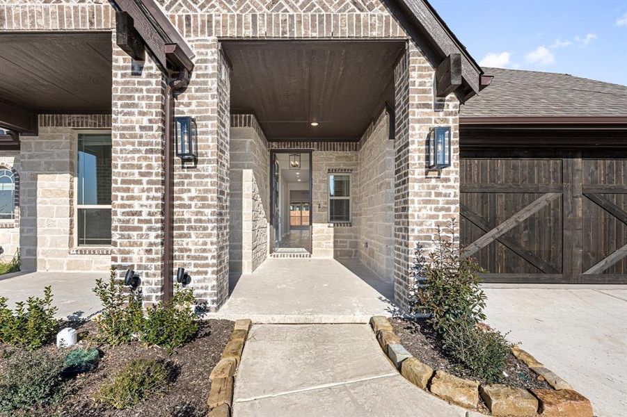 Exterior details and patio area of a home in Hayes Crossing, Midlothian (Image 3).