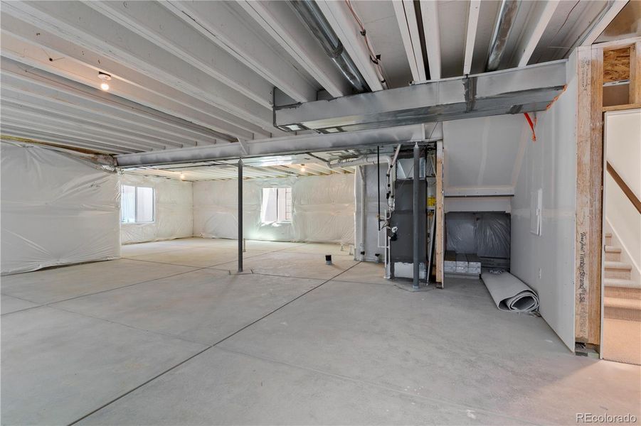 Unfinished lower level with rough in
