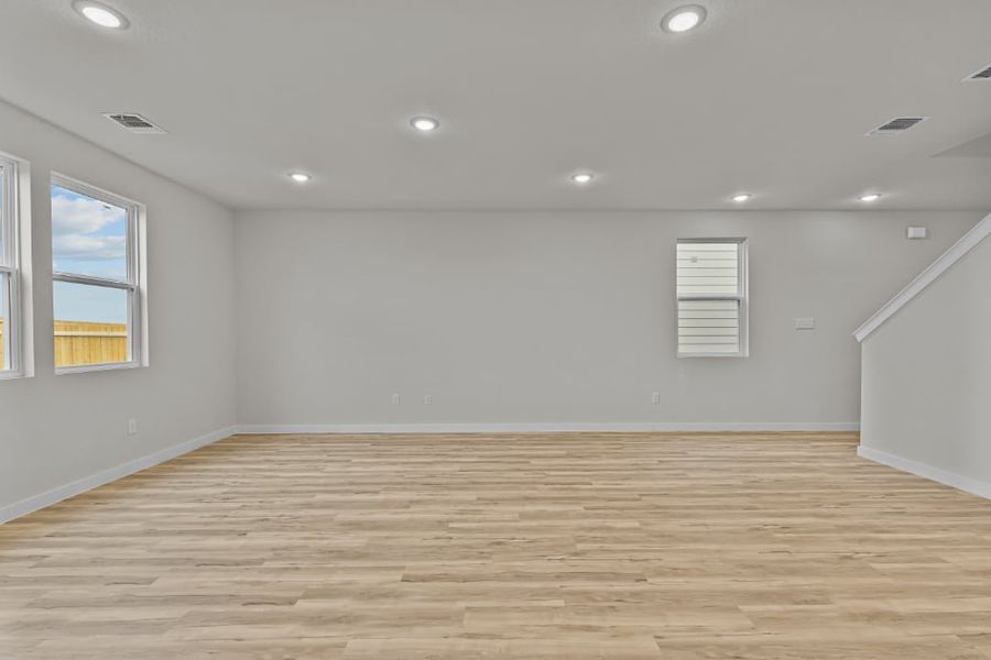 A room with a wood floor and a wood floor.