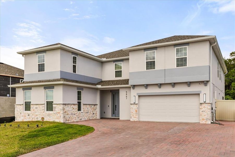 Front exterior of a new home in Bargrove Estates, Mount Dora, FL, highlighting curb appeal (Image 1). Front exterior of a new home in Bargrove Estates, Mount Dora, FL, highlighting curb appeal (Image 1).