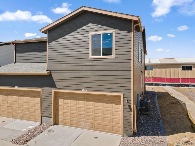 Front exterior of a new home in Spring Valley, Longmont, CO, highlighting curb appeal (Image 19).