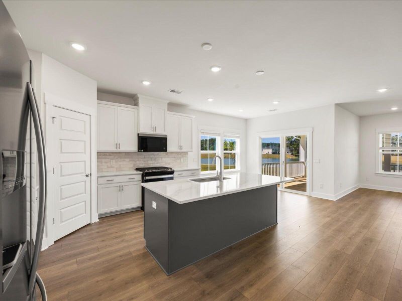 Furnished interior view inside a new home in The Coves at Lakes of Cane Bay, Summerville (Image 7). Furnished interior view inside a new home in The Coves at Lakes of Cane Bay, Summerville (Image 7).