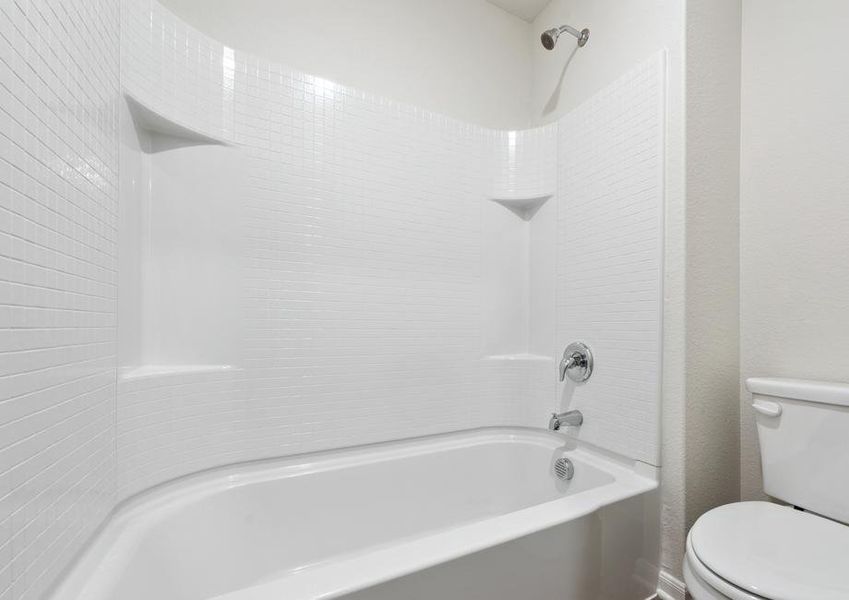 The secondary bathroom of the Driftwood has a shower-tub combo.