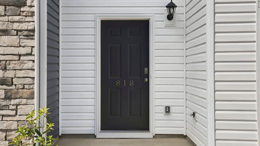 Exterior details and patio area of a home in Tanglewood Townes, Greenville (Image 4).