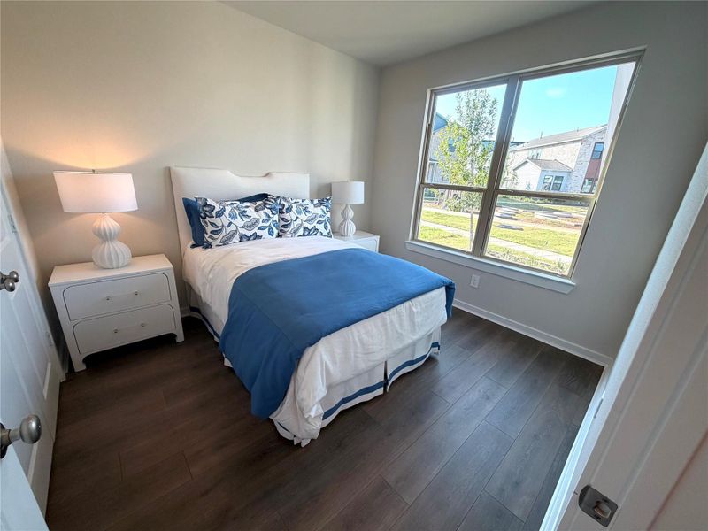 Two bedroom downstairs with guest bedroom with its own bath at the front of the home with view of Somersault Mews courtyard.