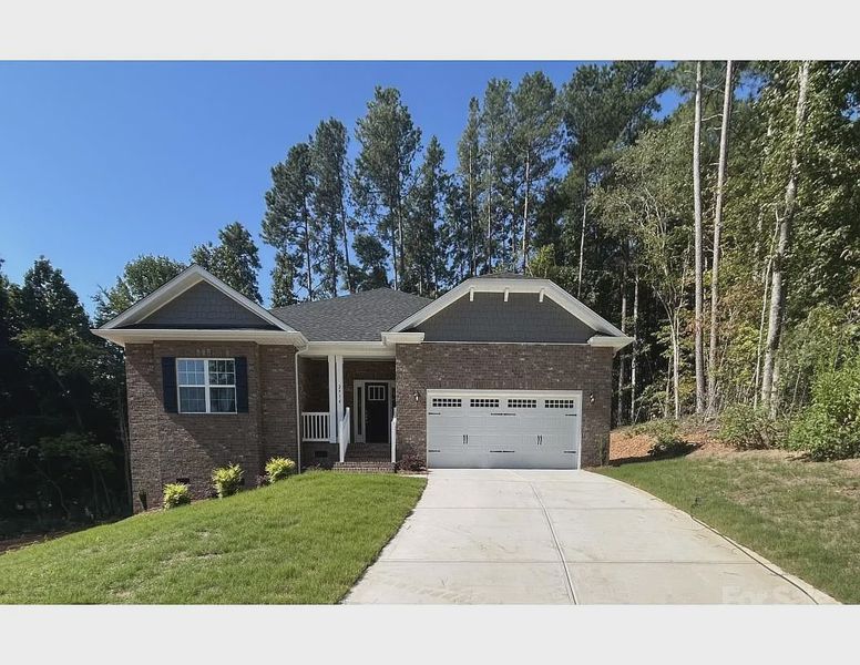 Front exterior of a new home in Crystal Village, Albemarle, NC, highlighting curb appeal (Image 1). Front exterior of a new home in Crystal Village, Albemarle, NC, highlighting curb appeal (Image 1).