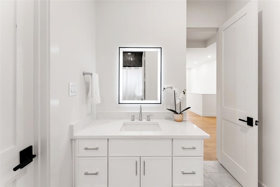 Secondary bathroom vanity area.
