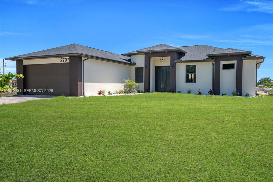 Front exterior of a new home in , Lehigh Acres, FL, highlighting curb appeal (Image 25).