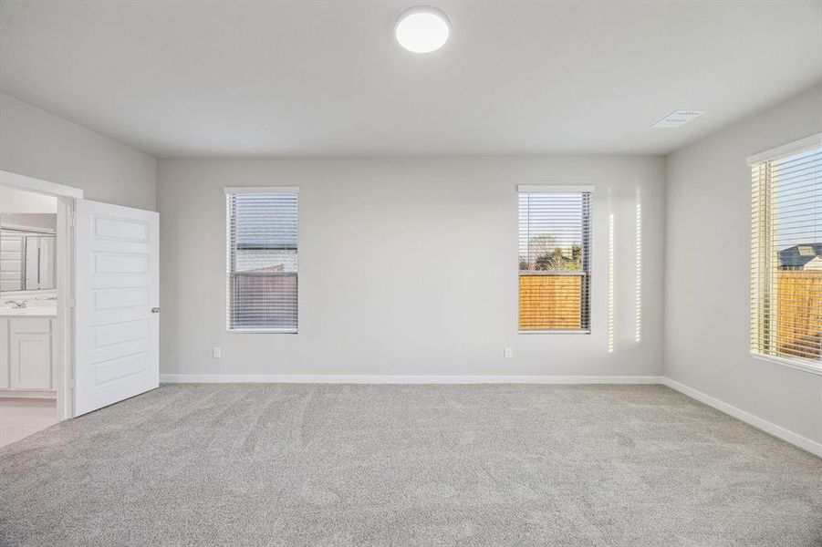 Primary Suite in the Wimbledon home plan by Trophy Signature Homes – REPRESENTATIVE PHOTO