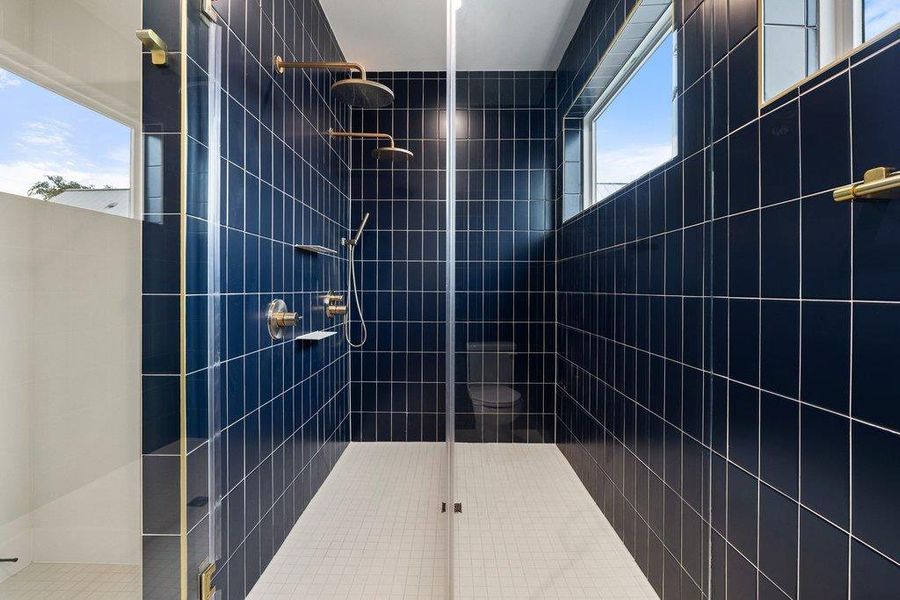 Bathroom featuring tiled shower
