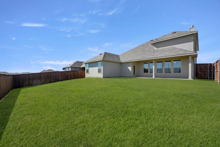Representative exterior photo of a completed home built from the Radcliffe by Impression Homes in Timberbrook, Justin, TX (Image 25).