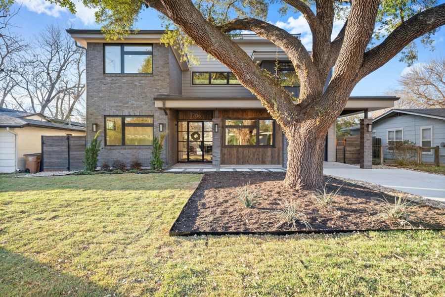 View of front of property with brick siding and driveway