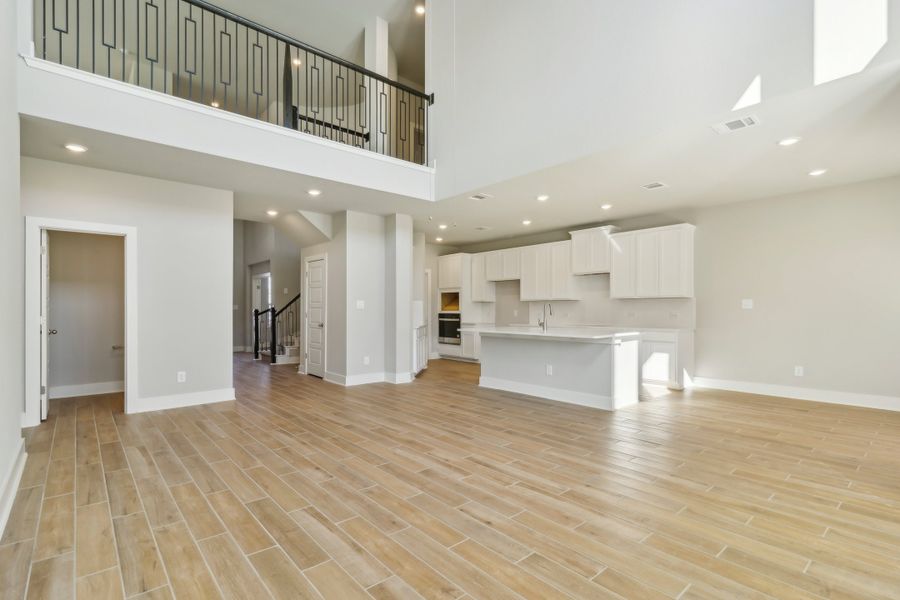 Living room and kitchen in the Cedar floorplan at a Meritage Homes community.