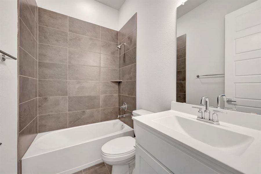 Bathroom featuring vanity and shower / bathtub combination