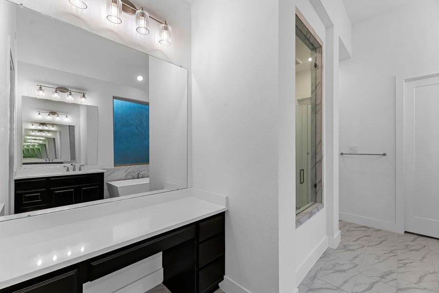 Additional view of the vanity area in the primary bathroom. Additional view of the vanity area in the primary bathroom.
