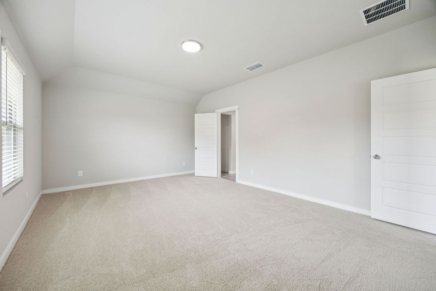 Primary Suite in the Hayden home plan by Trophy Signature Homes – REPRESENTATIVE PHOTO