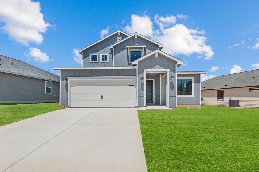 Representative exterior photo of a completed home built from the Poinsettia by Hakes Brothers in Hickory Ridge, Elmendorf, TX (Image 1). Representative exterior photo of a completed home built from the Poinsettia by Hakes Brothers in Hickory Ridge, Elmendorf, TX (Image 1).