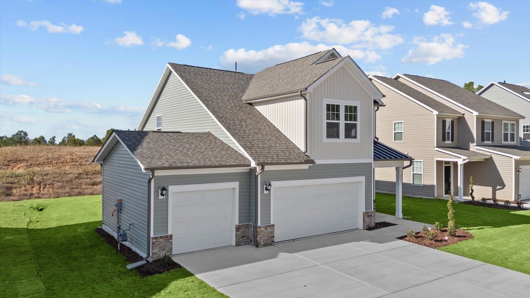 Representative exterior photo of a completed home built from the Freesia by DRB Homes in Essex Village, Franklinton, NC (Image 26).