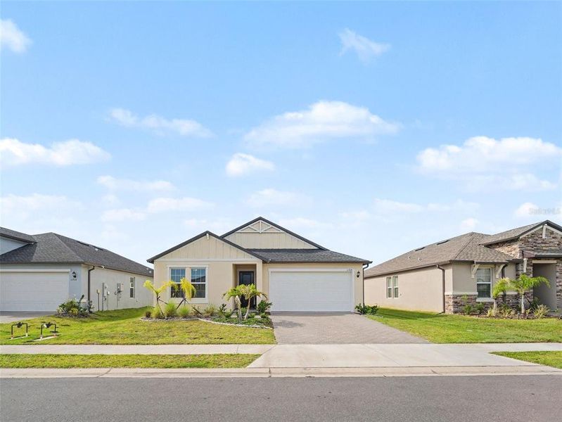 Front exterior of a new home in Stonegate Preserve, Palmetto, FL, highlighting curb appeal (Image 22).