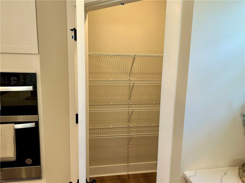 Ample wire shelving maximizes storage in this kitc