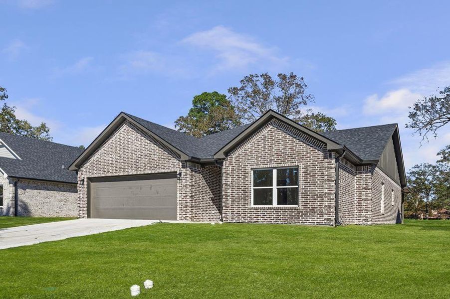 Front exterior of a new home in , Lufkin, TX, highlighting curb appeal (Image 14). Front exterior of a new home in , Lufkin, TX, highlighting curb appeal (Image 14).