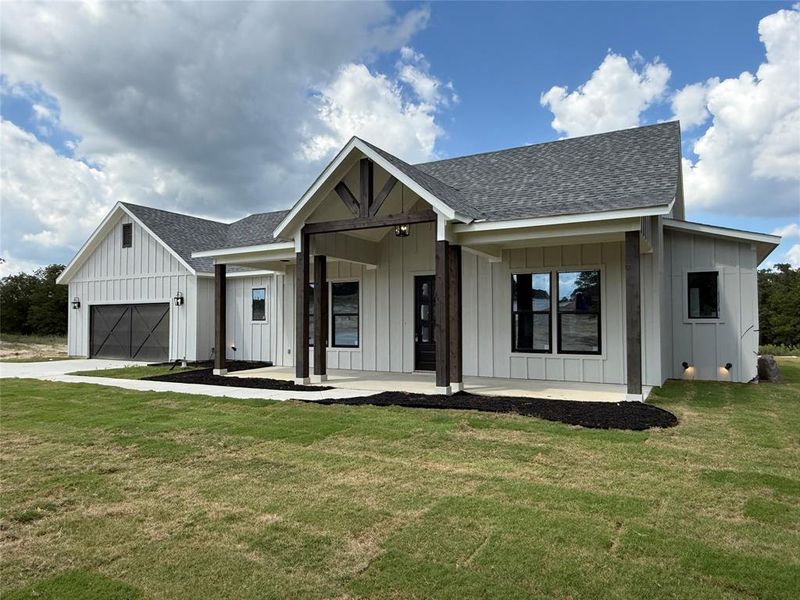 Front exterior of a new home in Zion Trails, Poolville, TX, highlighting curb appeal (Image 26). Front exterior of a new home in Zion Trails, Poolville, TX, highlighting curb appeal (Image 26).