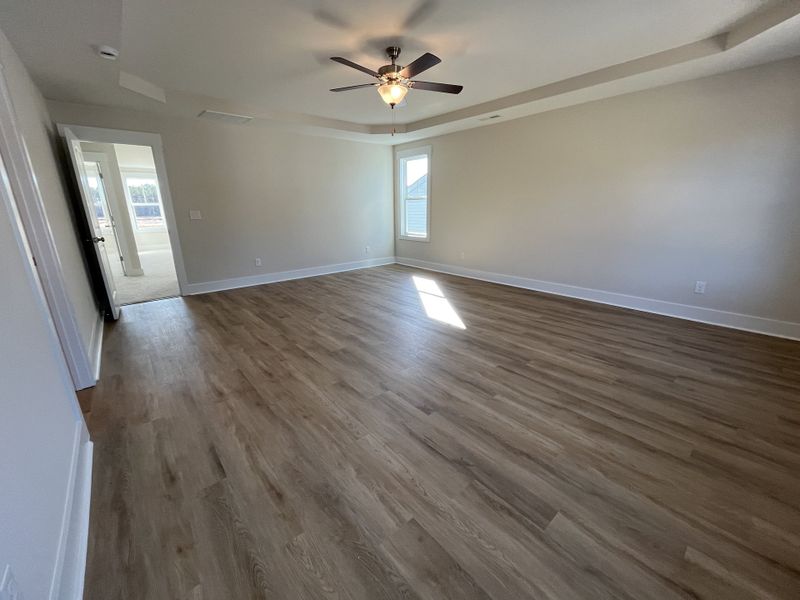 Spacious, unfurnished interior of a new home in River Tide Farms, Bolivia (Image 24).