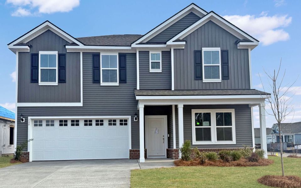 Front exterior of a new home in Crescent Cove, Myrtle Beach, SC, highlighting curb appeal (Image 16).