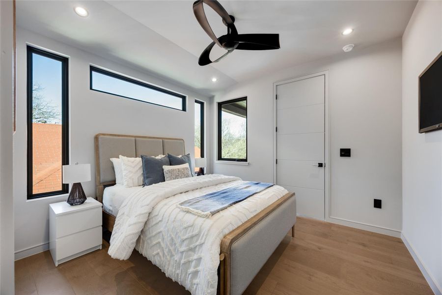 Owner's Suite featuring light wide wood floors