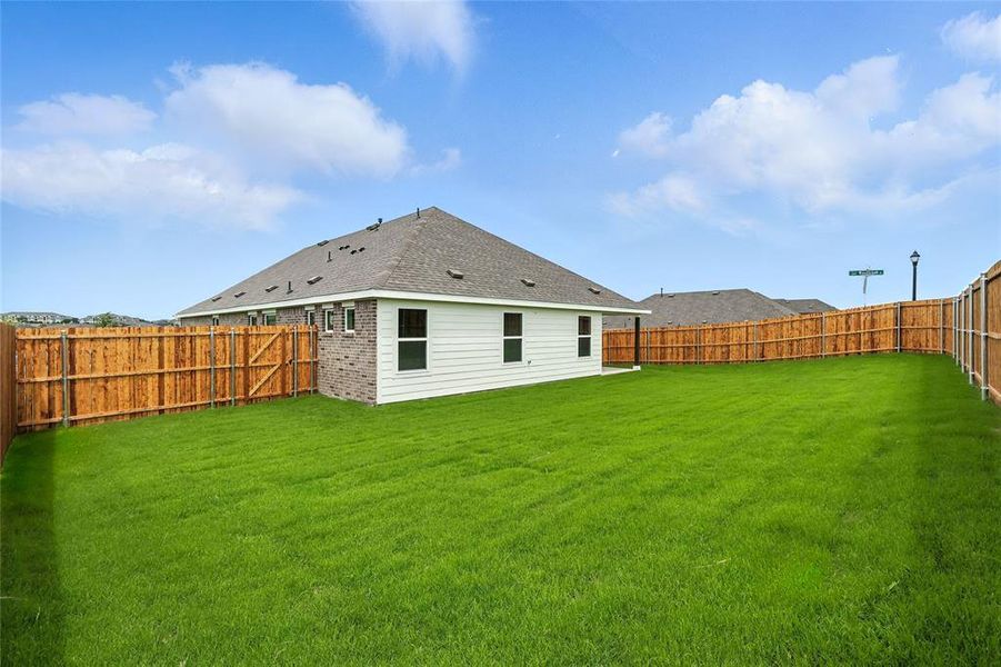 Back of house featuring a fenced backyard