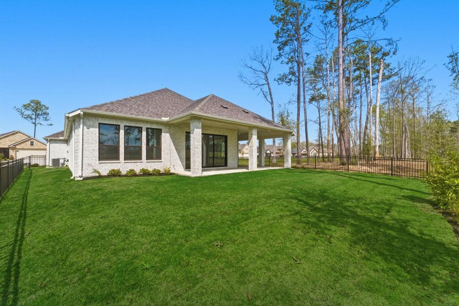 Exterior details and patio area of a home in The Highlands, Porter (Image 19).