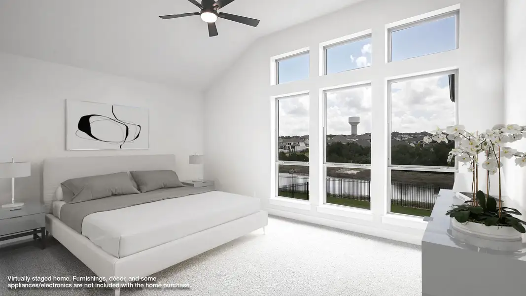 Bedroom featuring carpet flooring, high vaulted ceiling, and ceiling fan Bedroom featuring carpet flooring, high vaulted ceiling, and ceiling fan