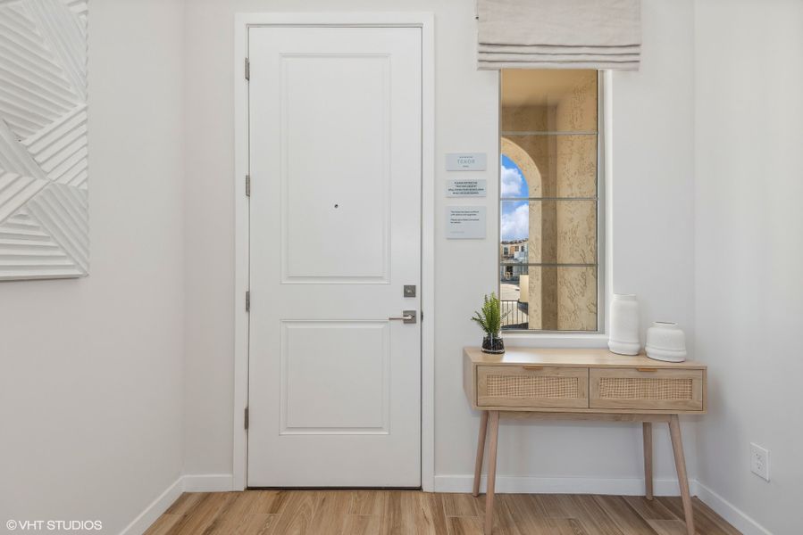 Welcoming foyer with tile flooring